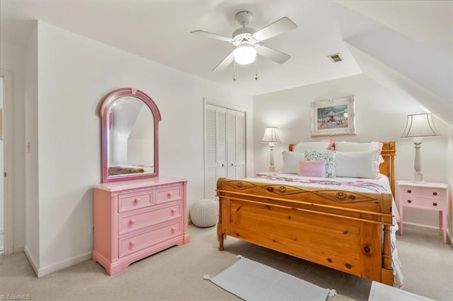 carpeted bedroom featuring a closet and ceiling fan