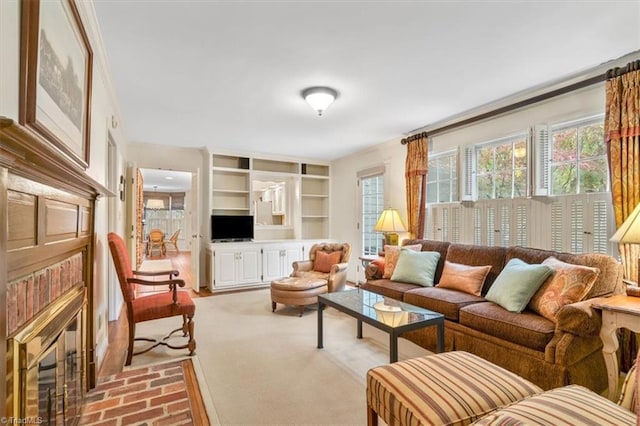 living room with light colored carpet and built in features