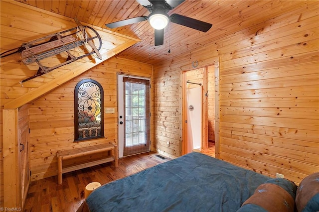 bedroom featuring wooden walls, ceiling fan, wood ceiling, and hardwood / wood-style flooring