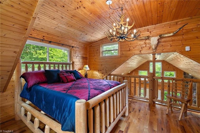 bedroom featuring lofted ceiling, wooden walls, wood-type flooring, wood ceiling, and a chandelier