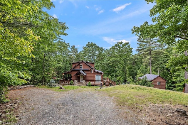 log-style house featuring a deck