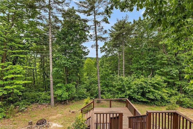 view of yard with a fire pit and a wooden deck