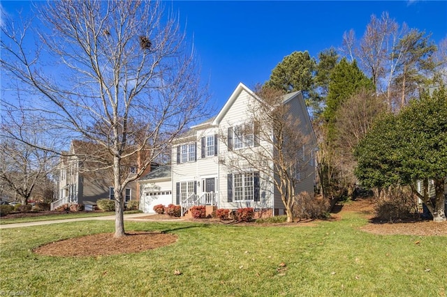 view of front of house featuring a garage and a front yard