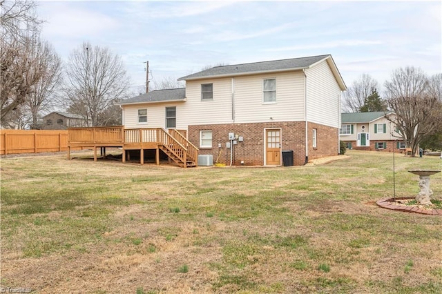 back of house with cooling unit, a yard, a deck, and fence