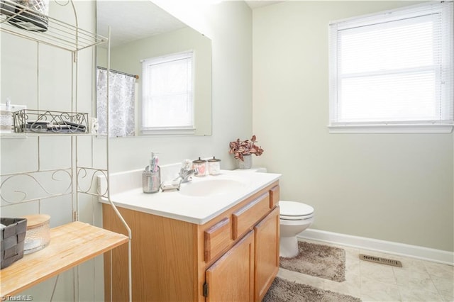 full bath with toilet, baseboards, visible vents, and vanity