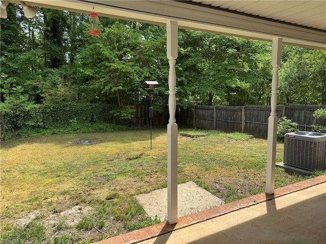 view of yard featuring a fenced backyard and central air condition unit
