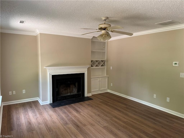 unfurnished living room featuring visible vents, ornamental molding, dark wood-style floors, a textured ceiling, and a ceiling fan