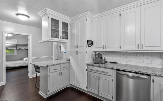 kitchen featuring dishwasher, white cabinets, light stone countertops, and dark hardwood / wood-style flooring