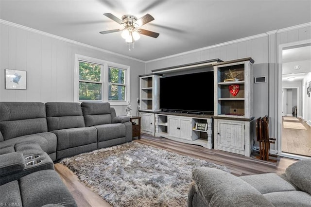 living room featuring ceiling fan, crown molding, and hardwood / wood-style floors