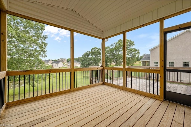 8004 Hacker Dr, Stokesdale, NC 27357 - unfurnished sunroom featuring lofted ceiling and a residential view