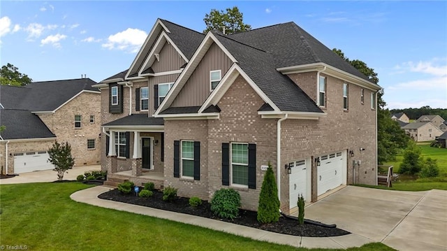 8004 Hacker Dr, Stokesdale, NC 27357 - view of front facade featuring board and batten siding, an attached garage, concrete driveway, brick siding, and a front lawn