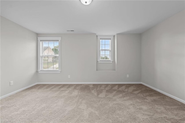 8004 Hacker Dr, Stokesdale, NC 27357 - empty room with carpet, healthy amount of natural light, and baseboards