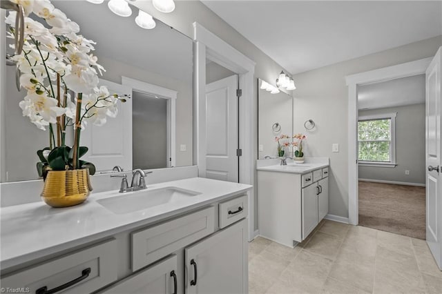 8004 Hacker Dr, Stokesdale, NC 27357 - full bathroom with two vanities and baseboards