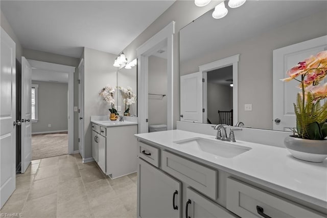 8004 Hacker Dr, Stokesdale, NC 27357 - bathroom with two vanities and baseboards