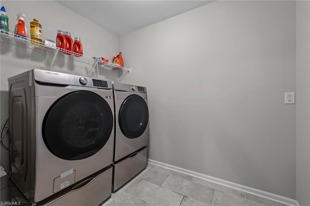8004 Hacker Dr, Stokesdale, NC 27357 - washroom with washer and dryer and baseboards