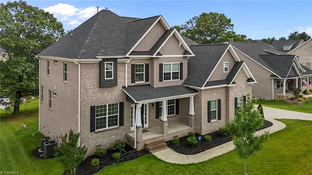 8004 Hacker Dr, Stokesdale, NC 27357 - view of front of house with board and batten siding, a front yard, concrete driveway, a shingled roof, and a porch