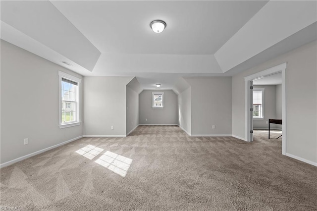 8004 Hacker Dr, Stokesdale, NC 27357 - empty room with a raised ceiling, light carpet, and baseboards