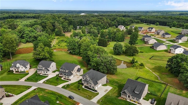 8004 Hacker Dr, Stokesdale, NC 27357 - aerial perspective of suburban area featuring a forest