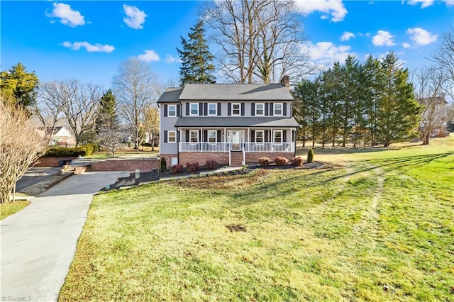 view of front of house featuring a front yard and a porch