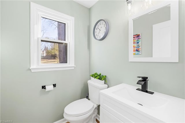 bathroom featuring toilet and vanity