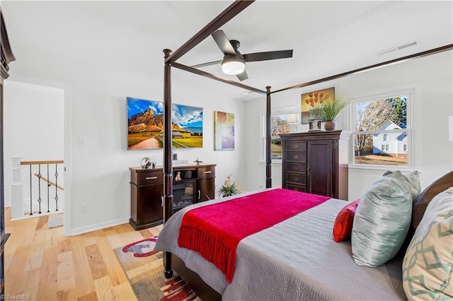 bedroom featuring ceiling fan and light hardwood / wood-style flooring