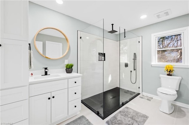 bathroom featuring toilet, tile patterned flooring, an enclosed shower, and vanity