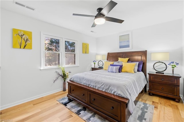 bedroom with light wood-type flooring and ceiling fan