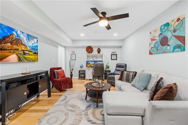 living room with ceiling fan and wood-type flooring