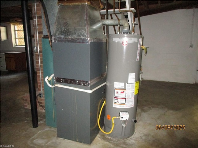 utility room featuring gas water heater and heating unit