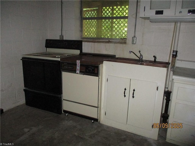 kitchen featuring electric range, white dishwasher, concrete floors, white cabinets, and a sink