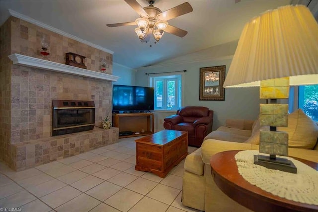 196 Watson Ln, Lexington, NC 27292 - living area with light tile patterned floors, vaulted ceiling, a ceiling fan, a glass covered fireplace, and ornamental molding