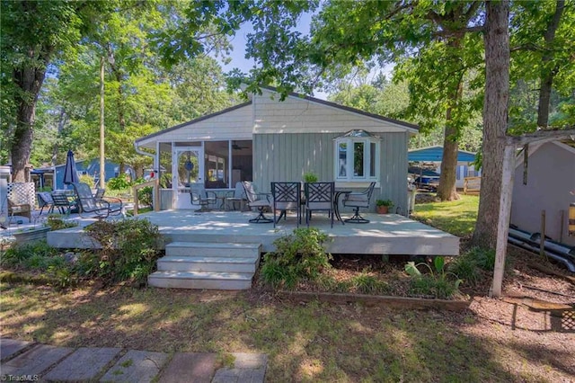196 Watson Ln, Lexington, NC 27292 - rear view of property featuring a sunroom, a wooden deck, and outdoor dining space