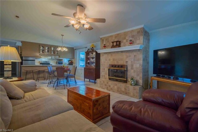 196 Watson Ln, Lexington, NC 27292 - living room with light tile patterned flooring, ceiling fan, crown molding, a chandelier, and a fireplace