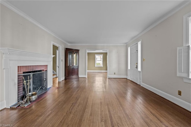 unfurnished living room featuring a fireplace, hardwood / wood-style floors, and ornamental molding