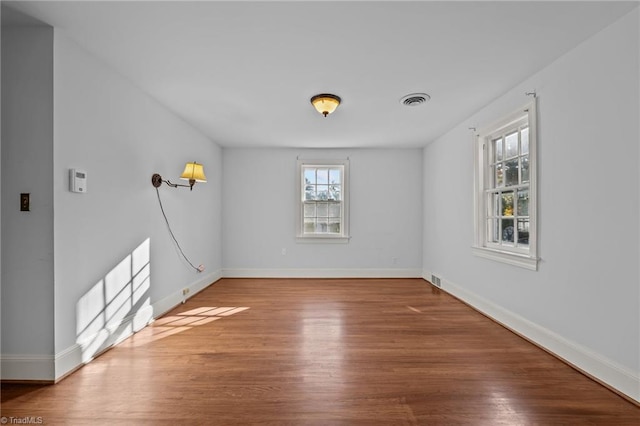 empty room featuring hardwood / wood-style floors