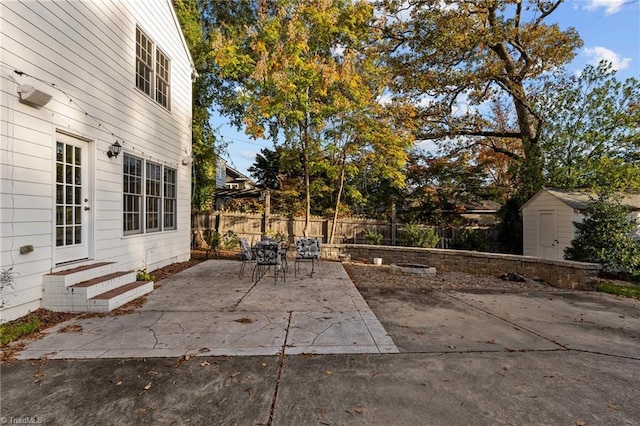 view of patio / terrace with a shed