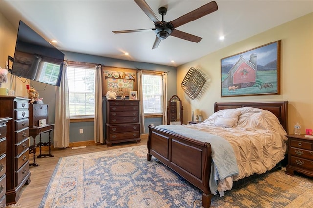 bedroom featuring ceiling fan and light hardwood / wood-style floors