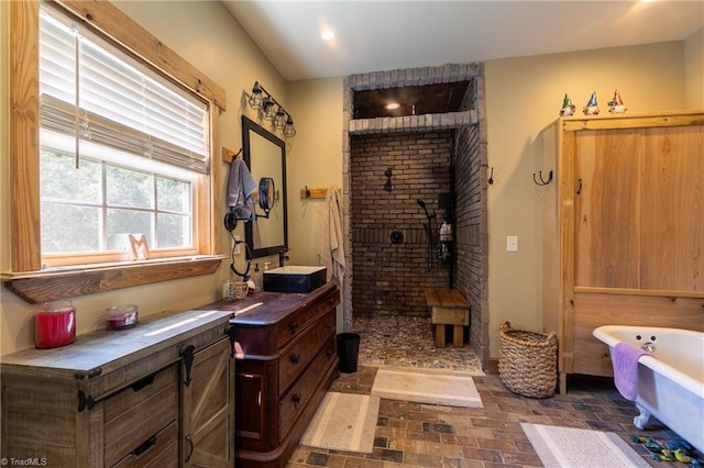 bathroom featuring vanity and plus walk in shower