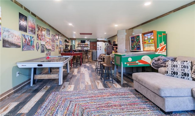 playroom with wood-type flooring and ornamental molding