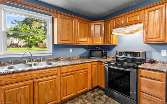 1115 Wachovia St, Winston-Salem, NC 27101 - kitchen featuring electric stove, under cabinet range hood, a sink, and brown cabinets