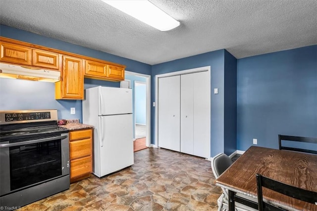 1115 Wachovia St, Winston-Salem, NC 27101 - kitchen with electric range, freestanding refrigerator, under cabinet range hood, a textured ceiling, and stone finish floors