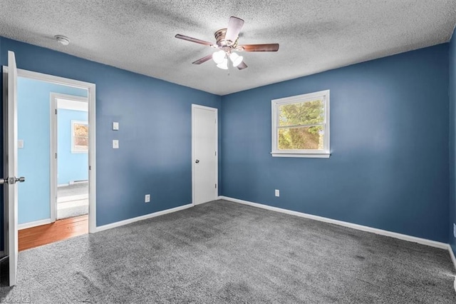 1115 Wachovia St, Winston-Salem, NC 27101 - unfurnished bedroom featuring carpet floors, baseboards, a textured ceiling, ceiling fan, and a closet