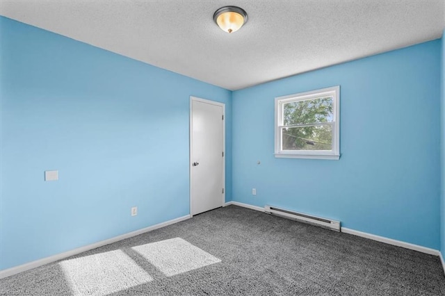 1115 Wachovia St, Winston-Salem, NC 27101 - spare room featuring a baseboard radiator, carpet floors, a textured ceiling, and baseboards