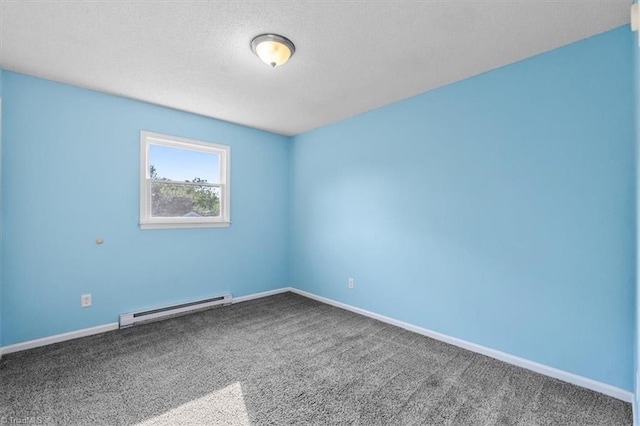 1115 Wachovia St, Winston-Salem, NC 27101 - spare room featuring a baseboard heating unit, carpet floors, baseboards, and a textured ceiling