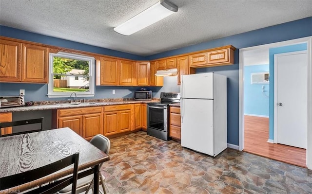 1115 Wachovia St, Winston-Salem, NC 27101 - kitchen with appliances with stainless steel finishes, a sink, under cabinet range hood, a textured ceiling, and stone finish floors