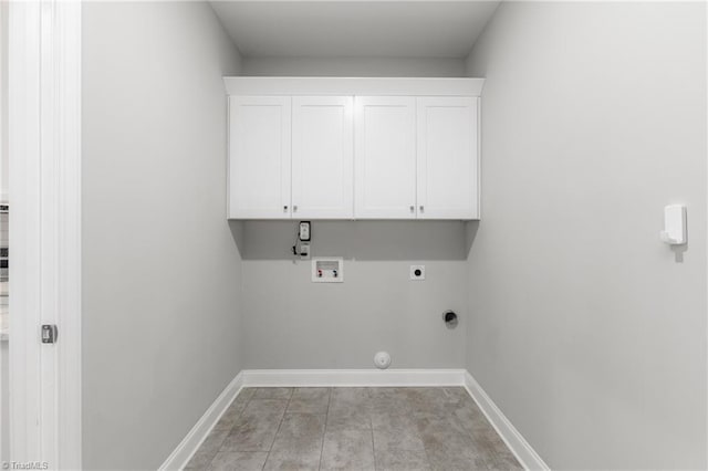 7028 Westfield Village Cir, Summerfield, NC 27358 - laundry room with hookup for a washing machine, electric dryer hookup, cabinet space, and gas dryer hookup