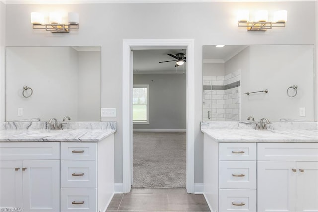 7028 Westfield Village Cir, Summerfield, NC 27358 - bathroom with two vanities, ceiling fan, ornamental molding, and a tile shower