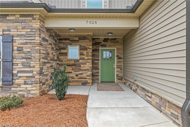 7028 Westfield Village Cir, Summerfield, NC 27358 - doorway to property featuring stone siding