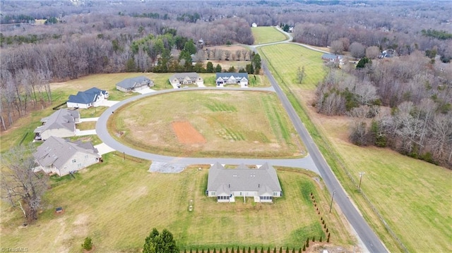 7028 Westfield Village Cir, Summerfield, NC 27358 - aerial view of property and surrounding area featuring rural landscape and a heavily wooded area