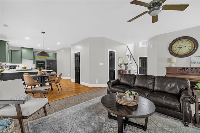 217 Oakmont Park Ct, Kernersville, NC 27284 - living room featuring stairs, ceiling fan, light wood-style floors, and recessed lighting
